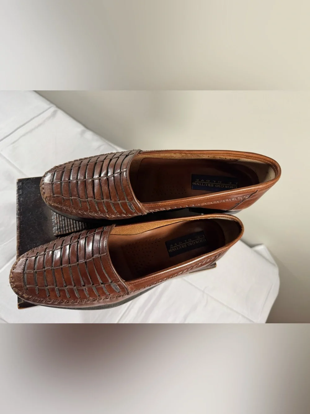 Giorgio Brutini brown leather slip-on loafers featuring a woven design